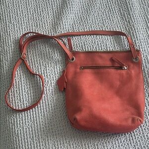 Pink Crossbody Bag with Adjustable Strap and Zipper Closure